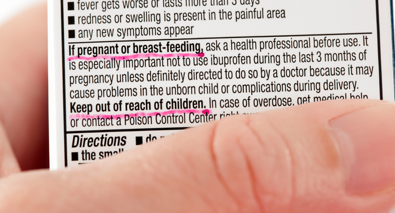 Warning label on medicine containing ibuprofen for pregnant women, and a warning about storing the medicine in a safe place away from children.